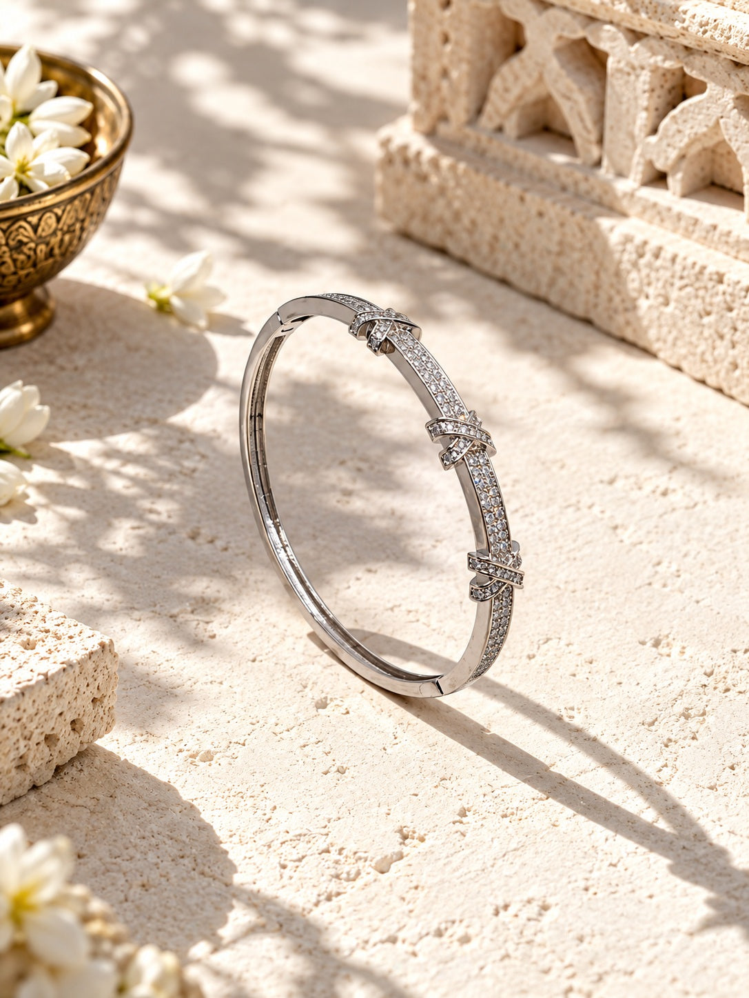 Silver plated bangle with durable colour stones on textured stone