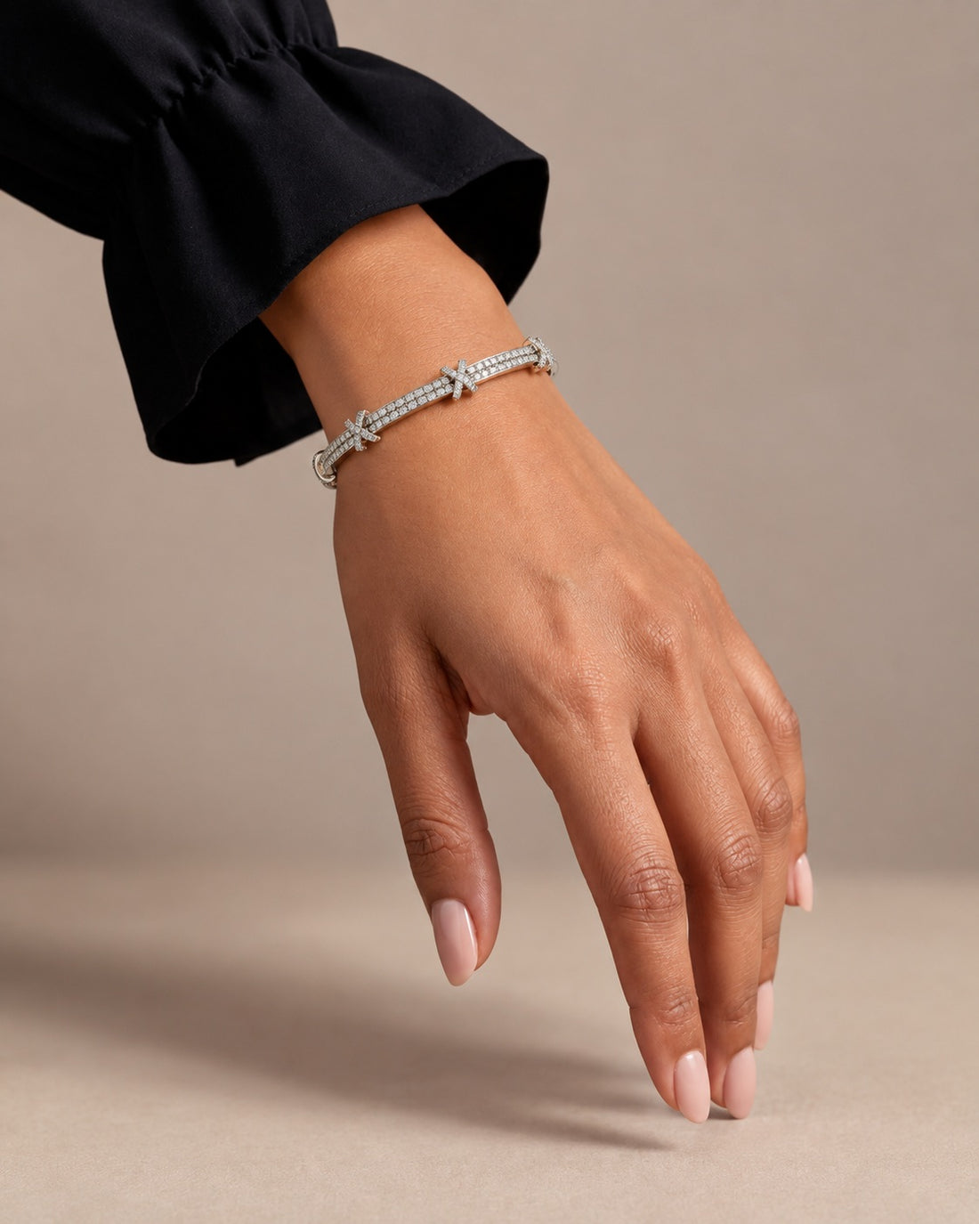 Model hand wearing silver plated AD stone bangle, no other jewellery