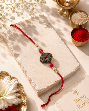 Niska Antique Oxidised Designer Rakhi with Red Stone