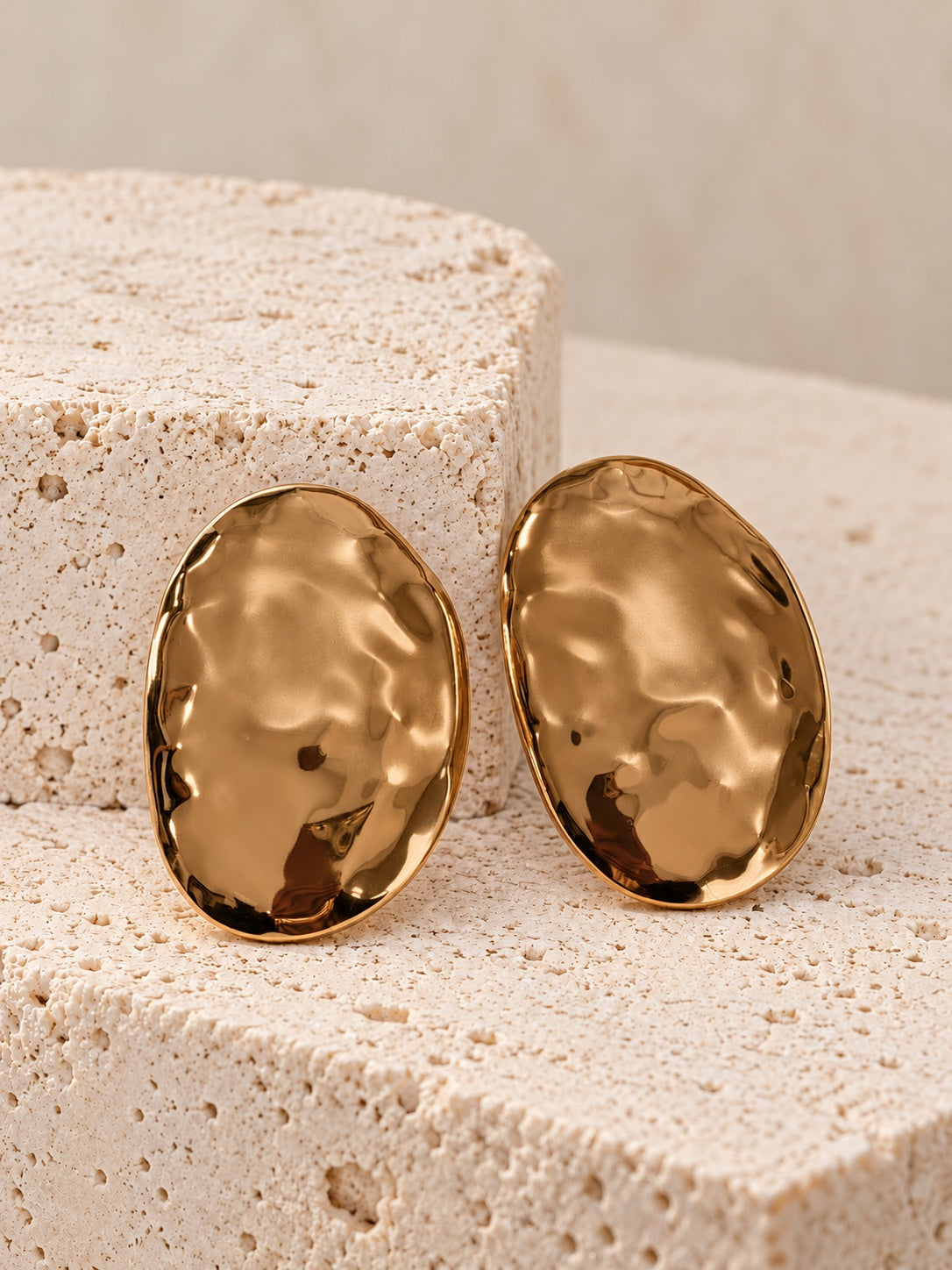 Gold tone oval statement earrings
