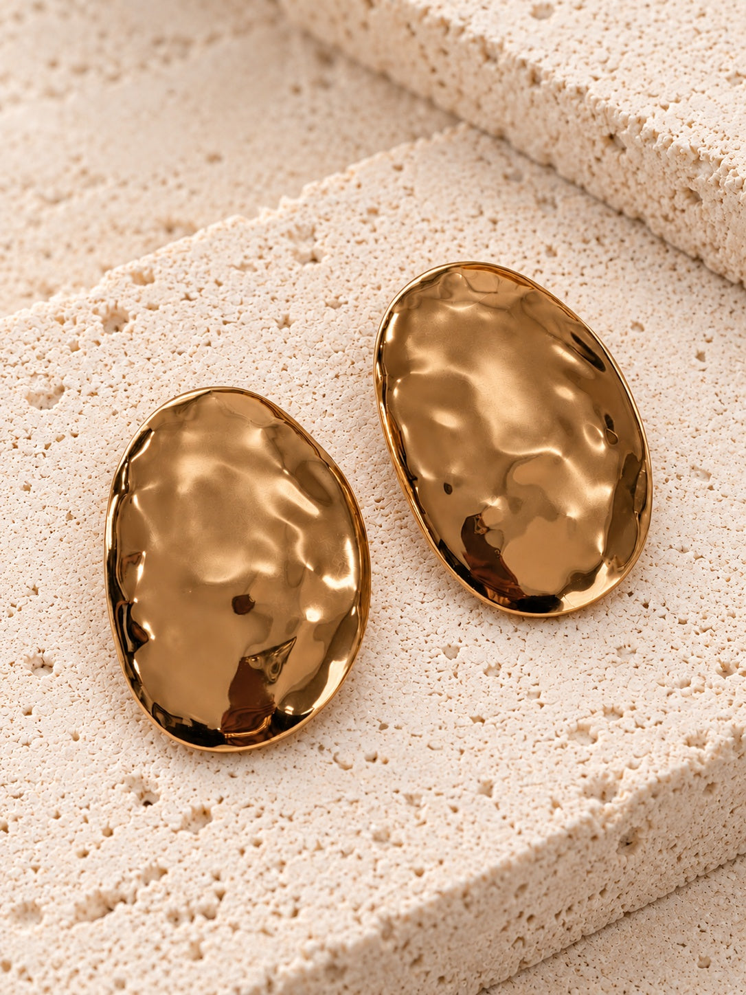 Gold tone oval statement earrings