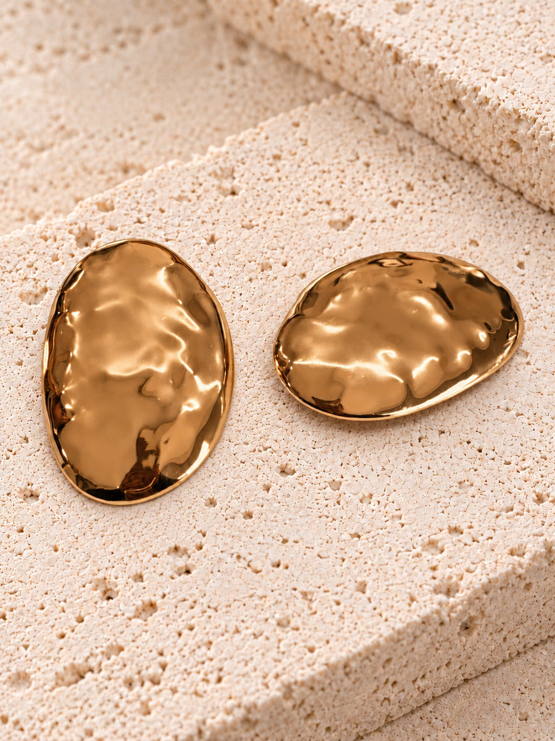 Gold tone oval statement earrings