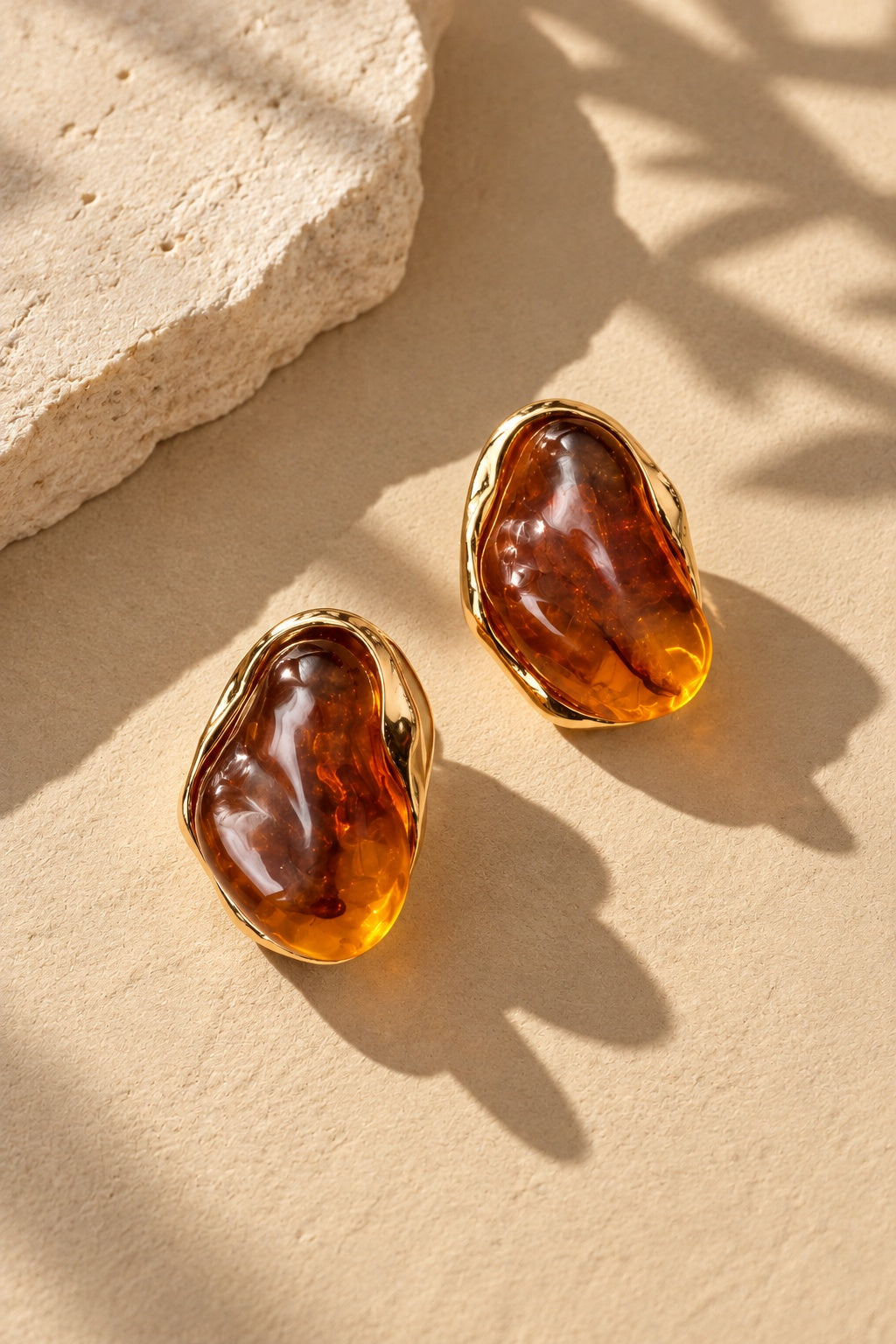 Amber resin stone gold earrings from alternate angle