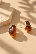 Amber resin stone gold earrings showing side profile