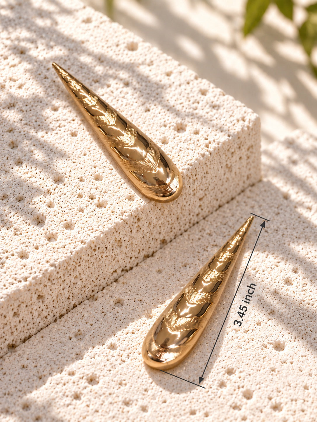 Gold-tone textured drop earrings with 3.45 inch length measurement