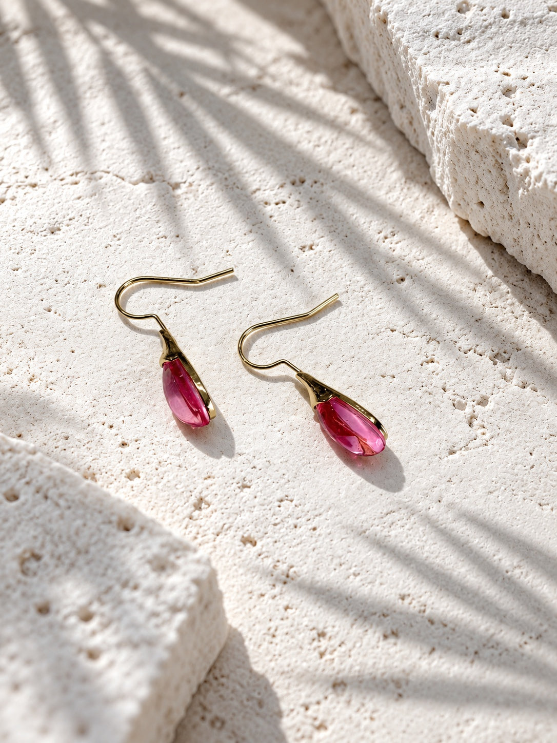 Niska rose pink teardrop earrings worn by model