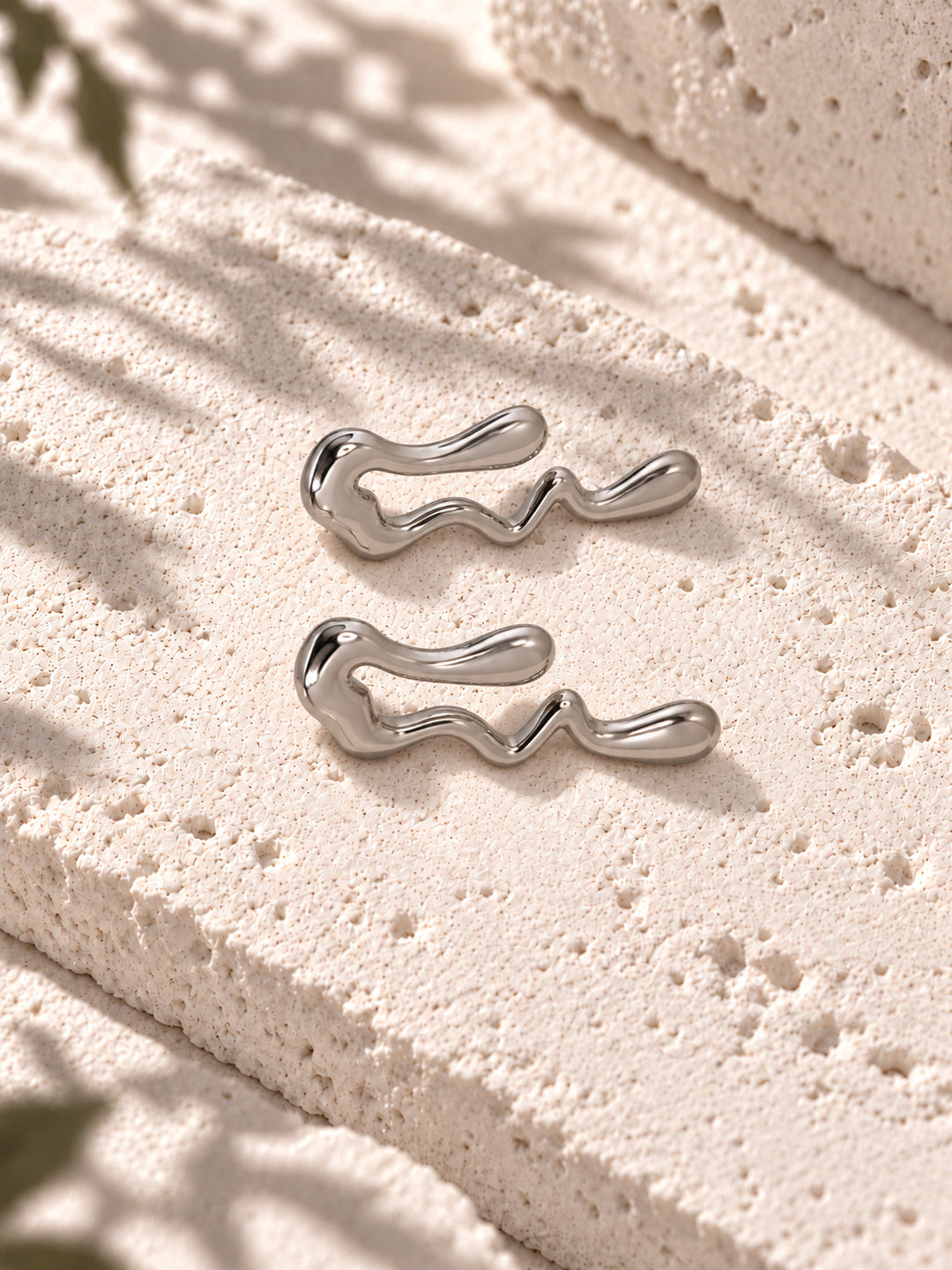 Niska silver-tone fluid wave statement earrings on white travertine – view 7 – ER26N10241