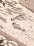 Niska silver-tone fluid wave statement earrings on white travertine – view 8 – ER26N10241