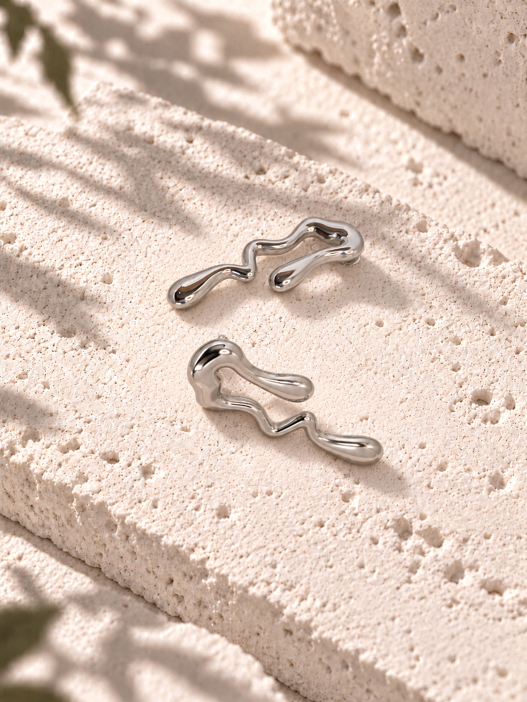 Niska silver-tone fluid wave statement earrings on white travertine – view 8 – ER26N10241