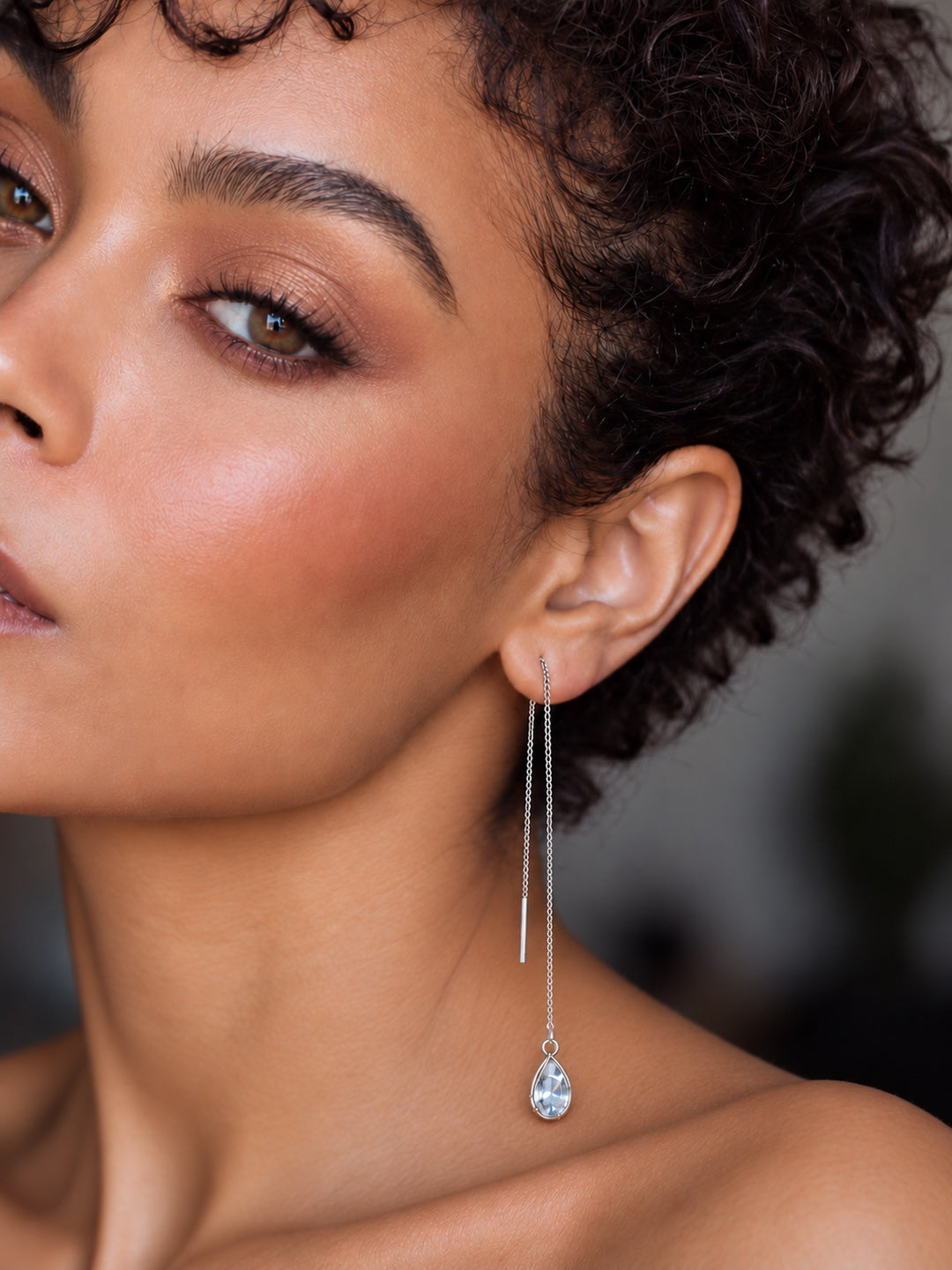 Niska silver-tone long teardrop threader earring worn at full length