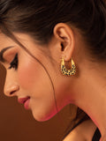 Model wearing gold and black leopard-print hoop earrings, close-up profile
