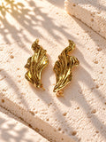 Niska gold-tone sculpted leaf Resin earrings on white travertine – view 6