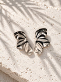 Silver-tone wave earrings angled front view