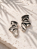 Sculptural folded silver-tone earrings staggered view