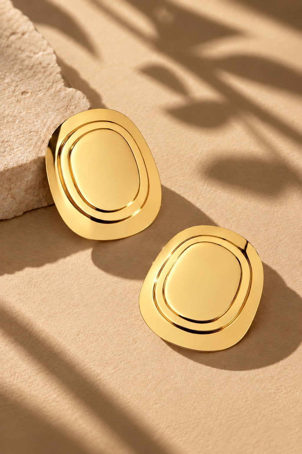 ER26N10277 gold concentric oval statement earrings – product angle 2