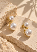 White pearl double-sphere earrings editorial product angle
