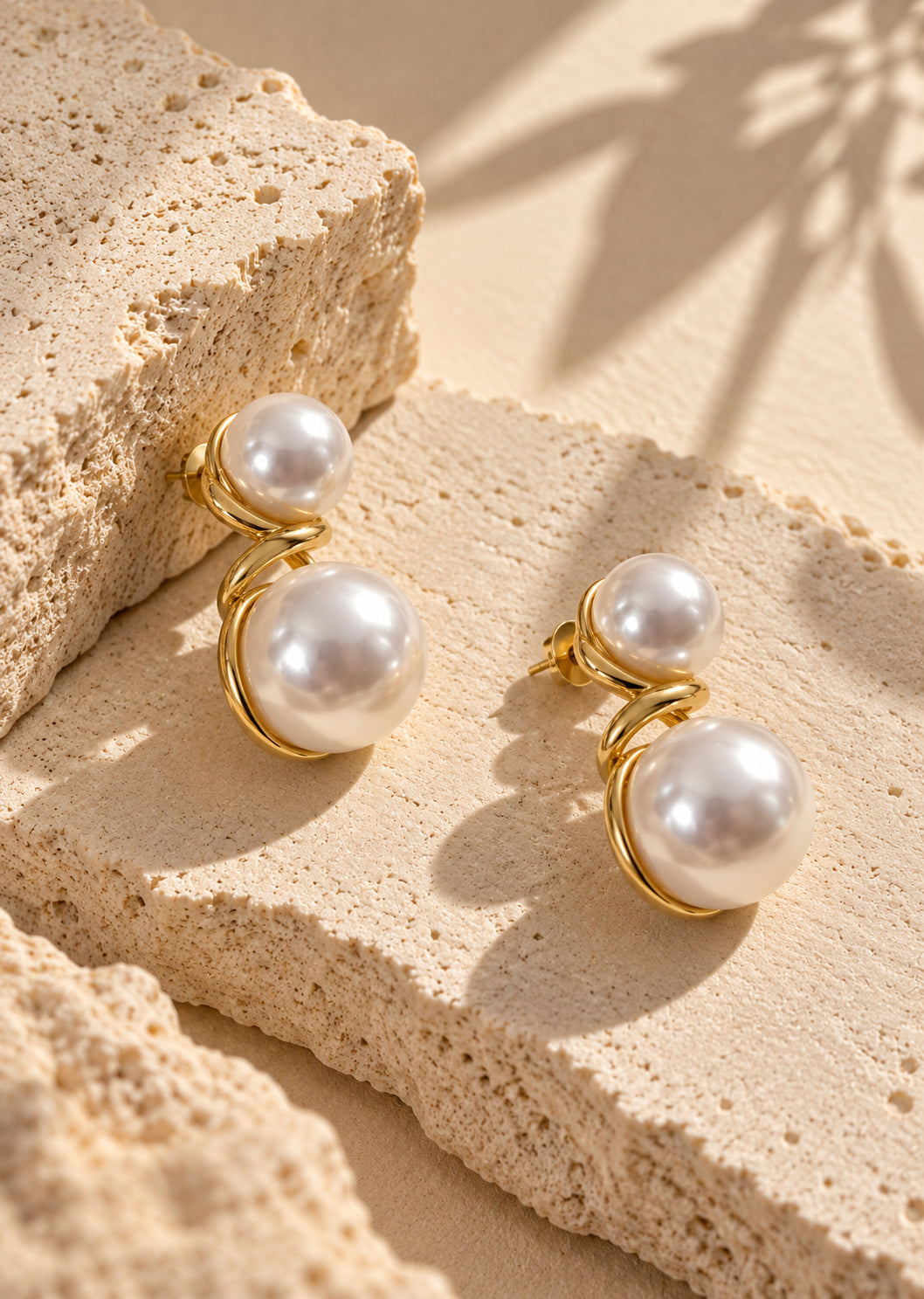 White pearl double-sphere earrings editorial product angle