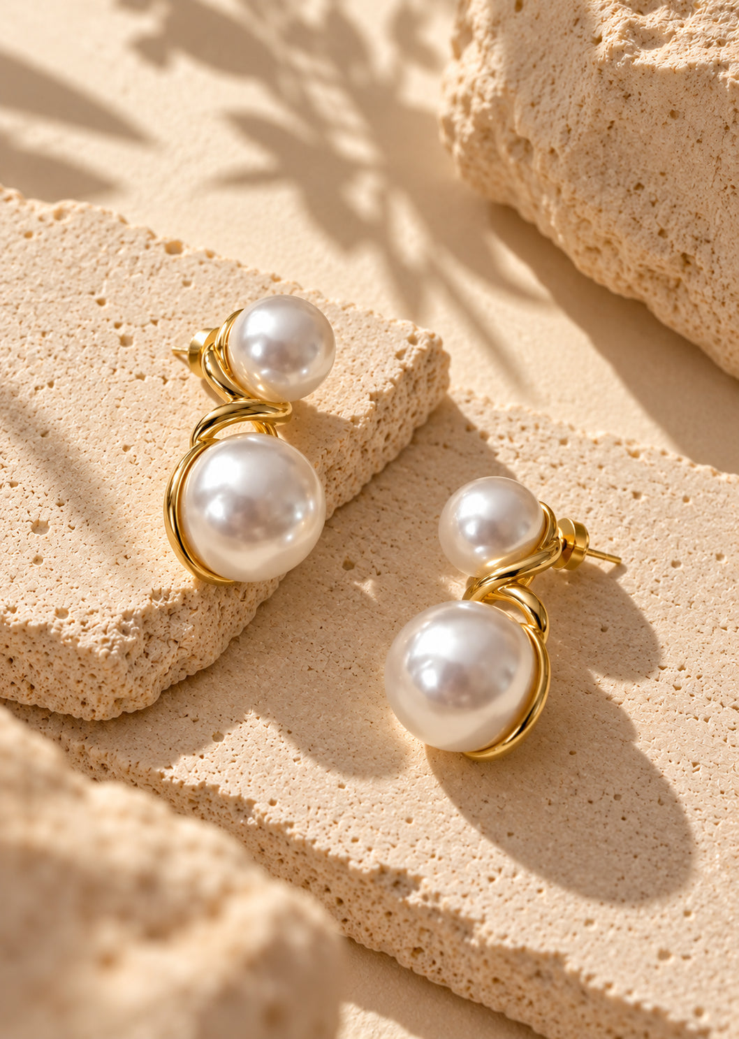 White pearl double-sphere earrings close-up product shot