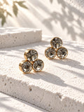 Niska triple crystal gold-tone stud earrings – angled view
