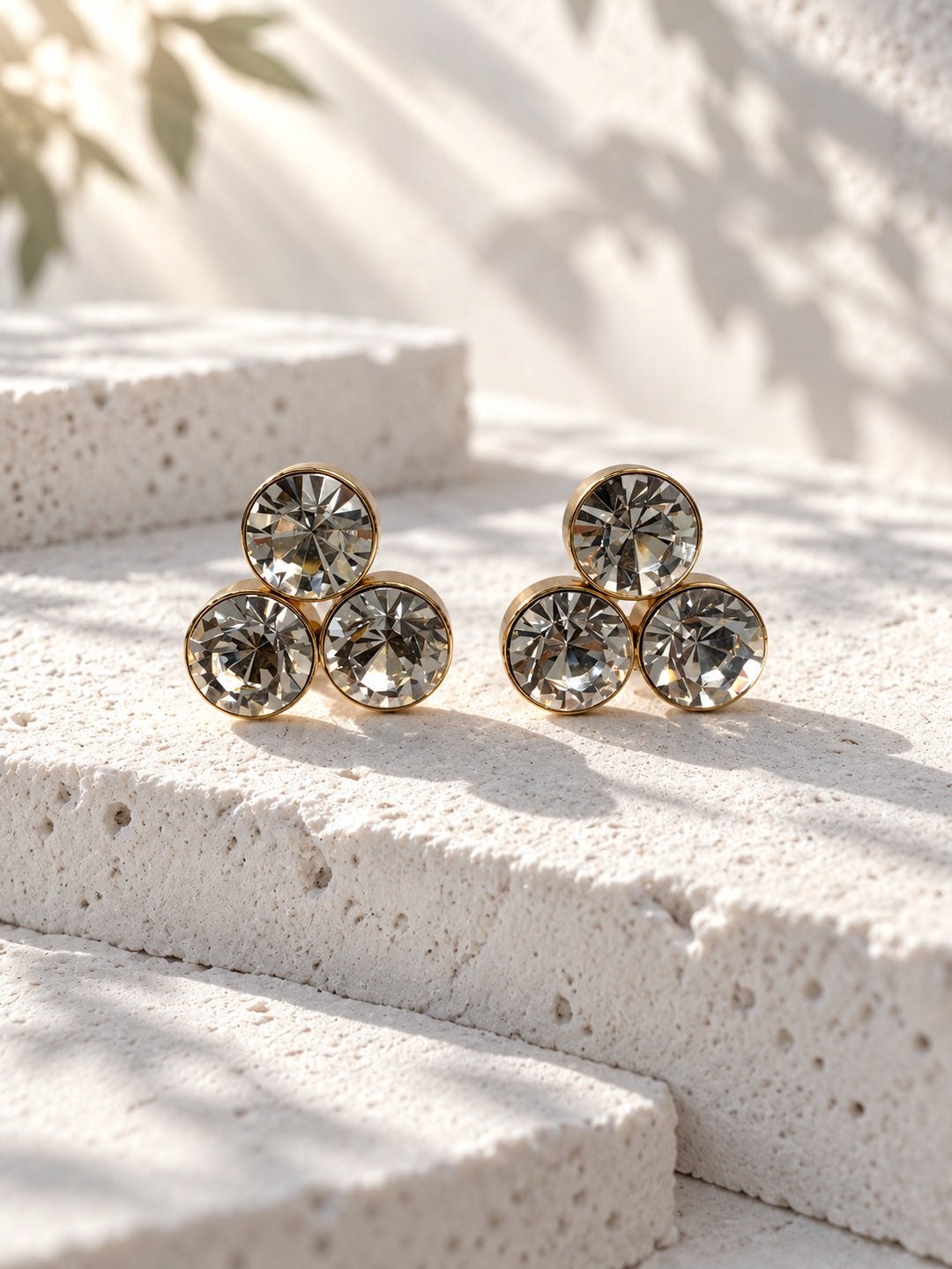Niska triple crystal gold-tone stud earrings – front view
