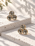 Niska triple crystal gold-tone stud earrings – staggered view