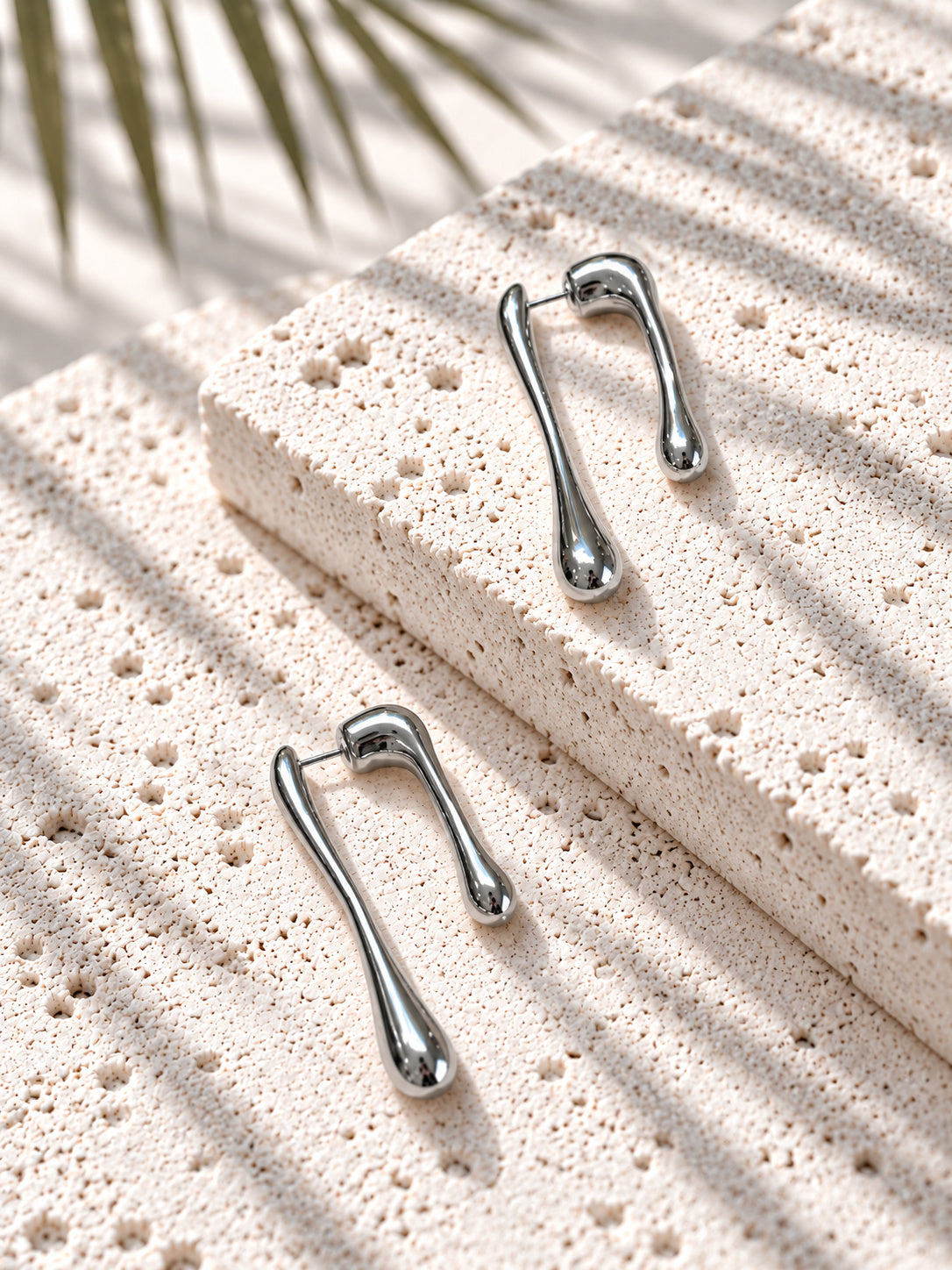 Silver tone asymmetric teardrop earrings