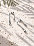 Silver tone asymmetric teardrop earrings