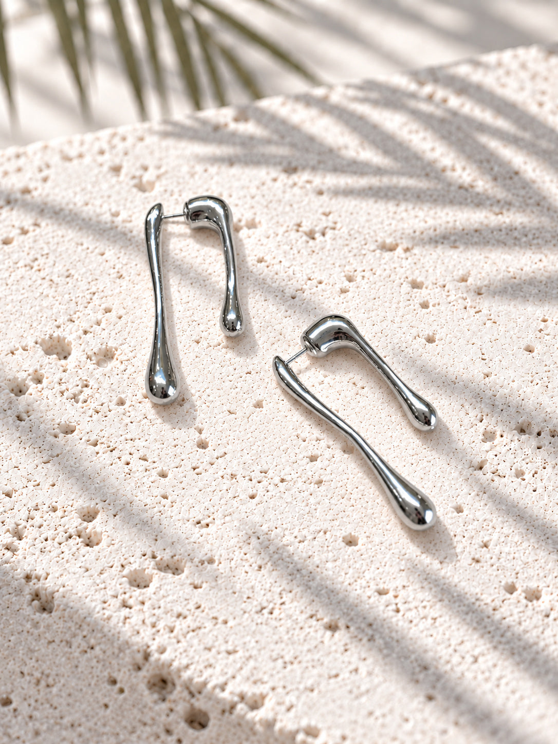 Silver tone asymmetric teardrop earrings
