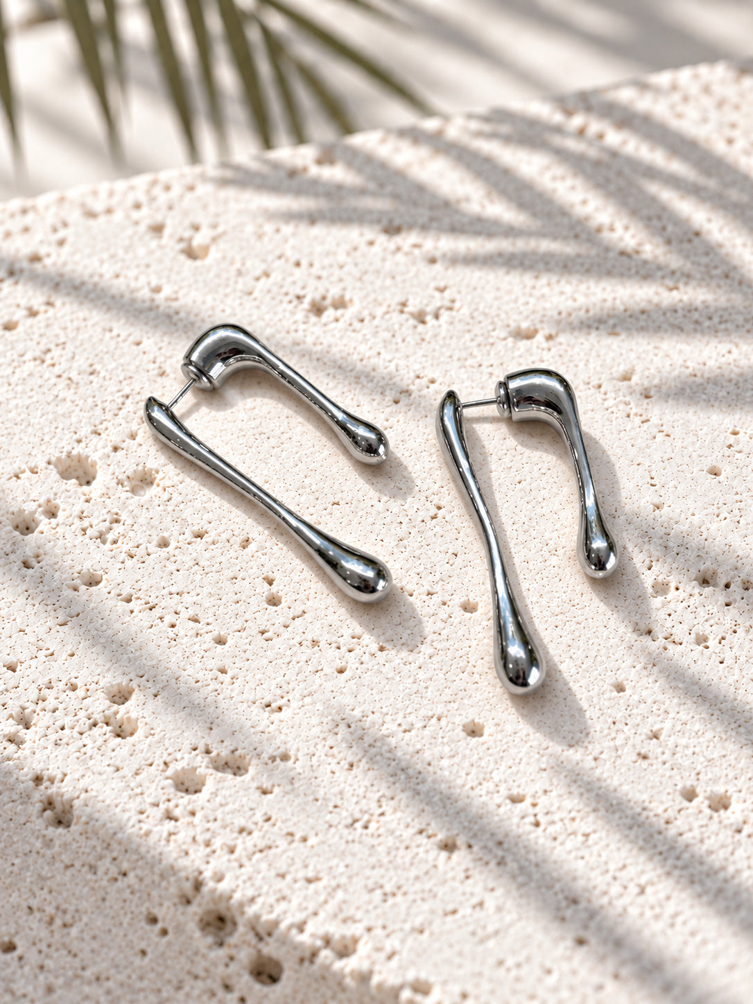 Silver tone asymmetric teardrop earrings