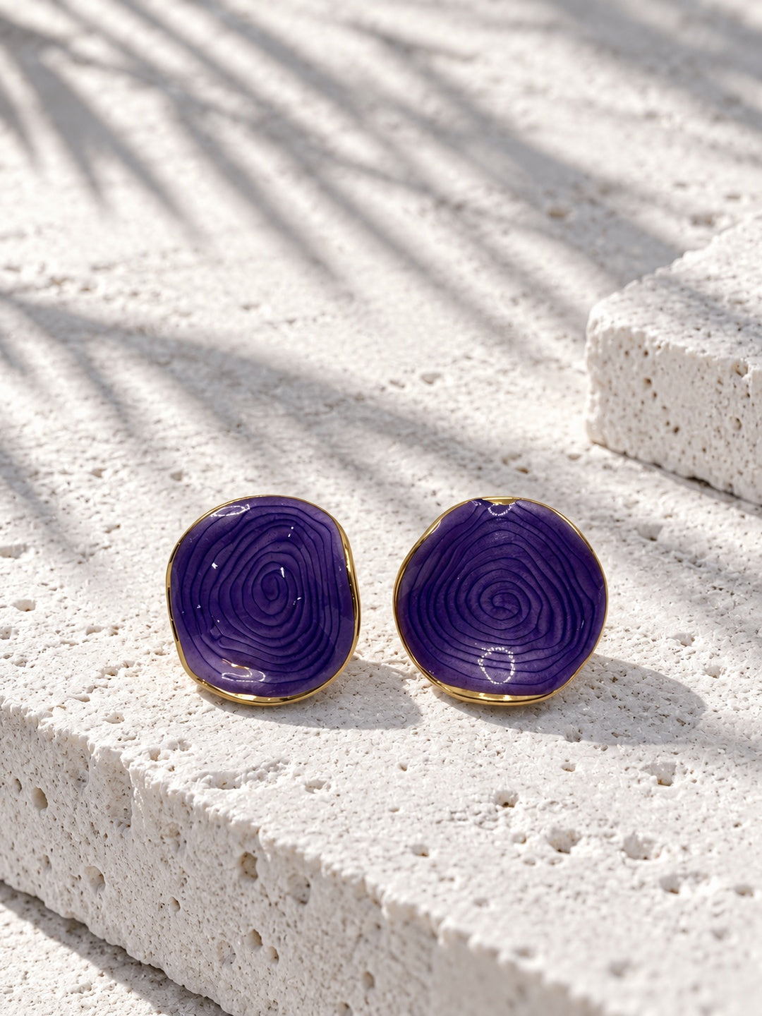 Model wearing Niska purple spiral statement stud earring