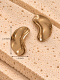 Gold tone curved earrings measuring 2.10 inch long and 1.35 inch wide