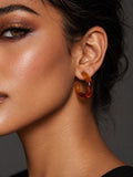 Model wearing Niska amber Resin C-hoop earring