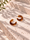 Niska amber Resin C-hoop earrings on white travertine - view 4