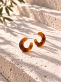Niska amber Resin C-hoop earrings on white travertine - view 12