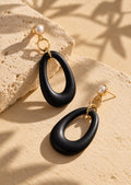 Black resin long earrings overhead angle