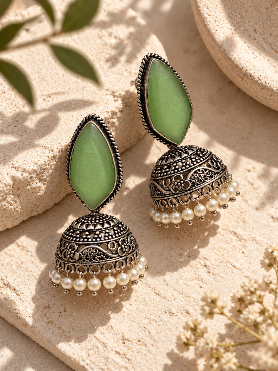 Monalisa green stone oxidized jhumka earrings close view