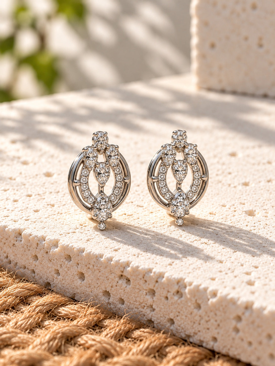 White AD Stone Silver Replica oval earrings worn by model