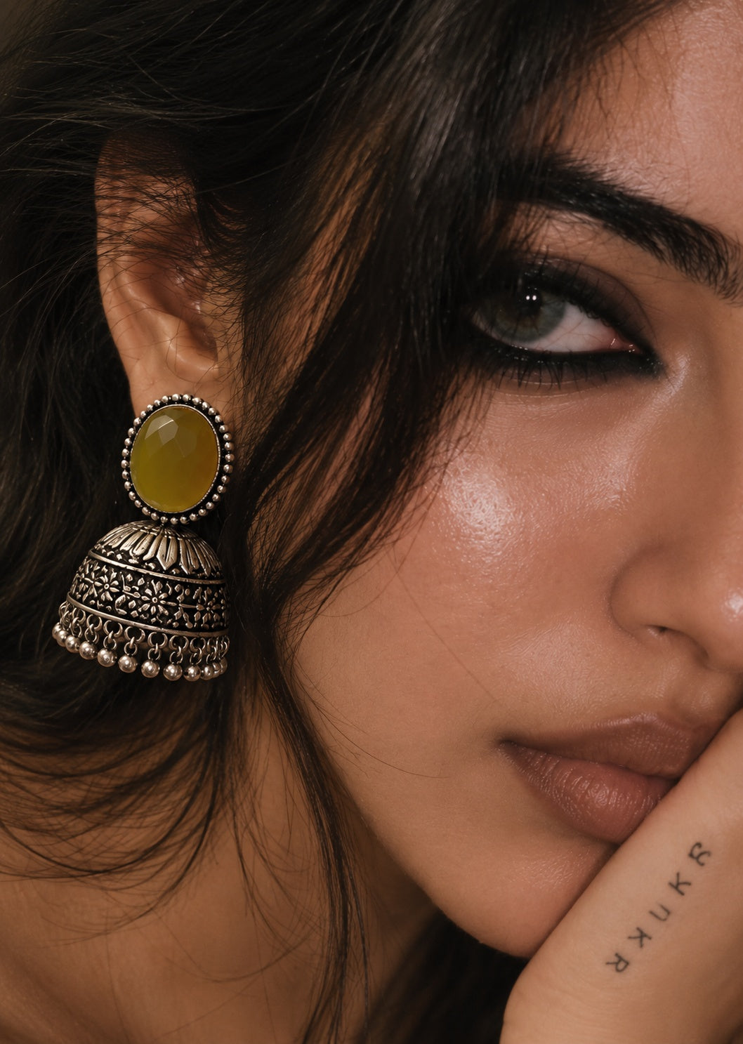 Monalisa Stone Silver replica jhumka worn by model