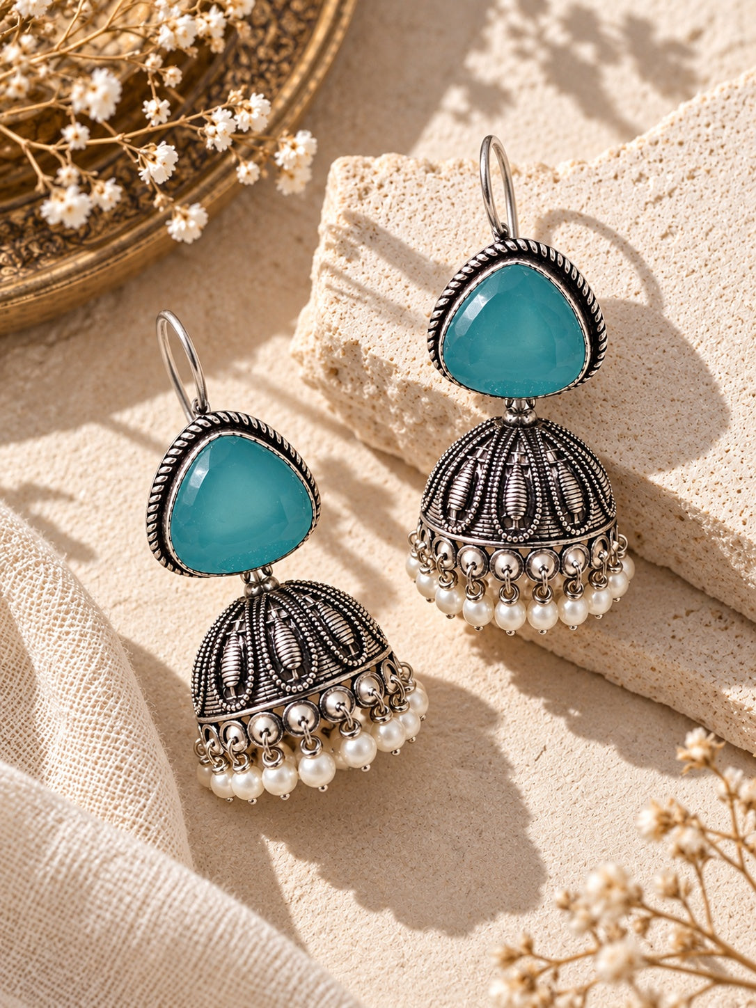 ER26N10356 Monalisa Stone Silver Replica Jhumka angled flat lay