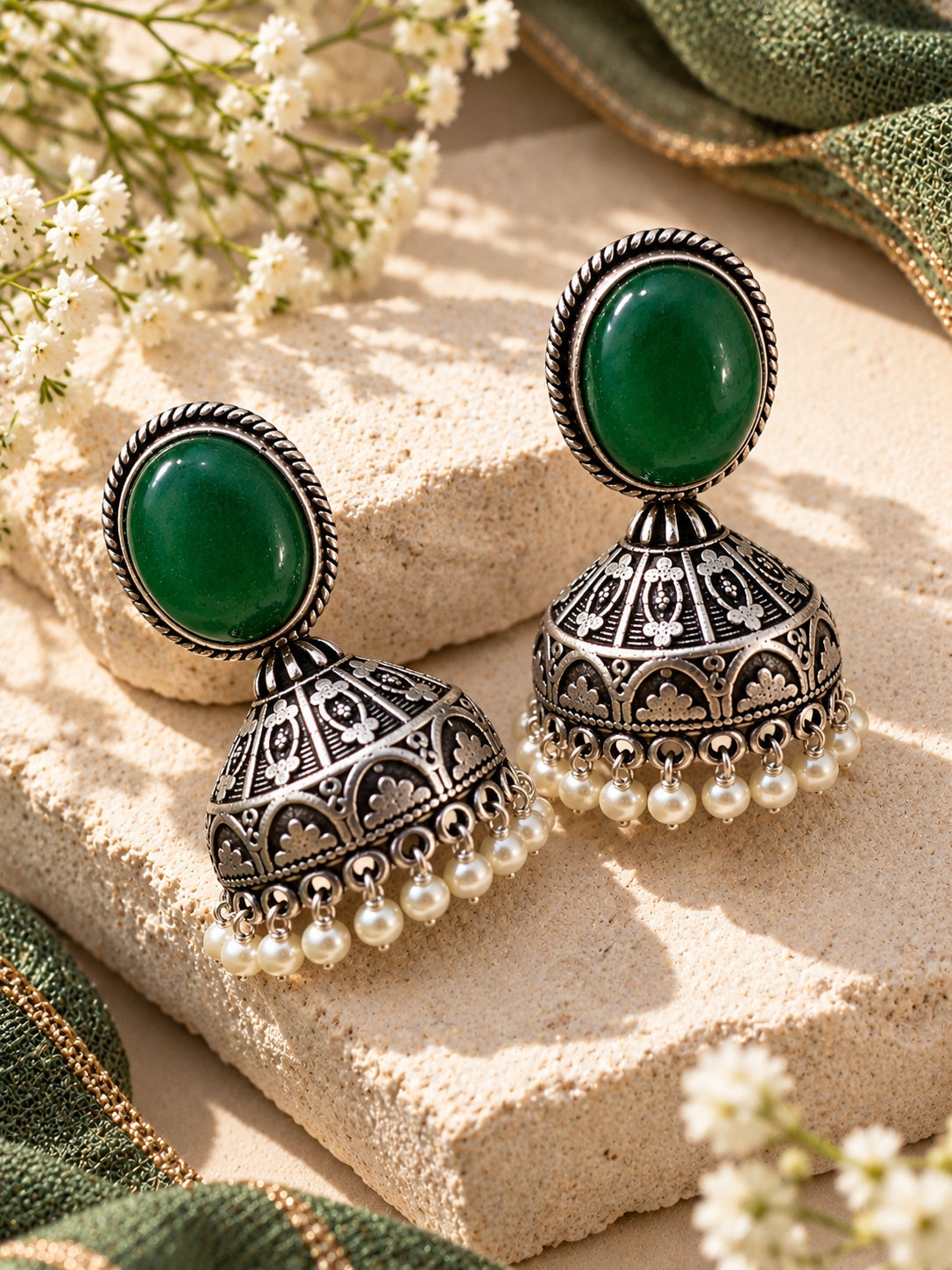 Oxidized silver jhumka earrings angled product shot