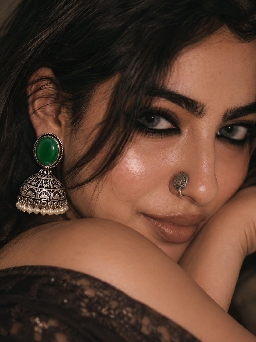 Model wearing Monalisa Stone Silver Replica green jhumka earrings
