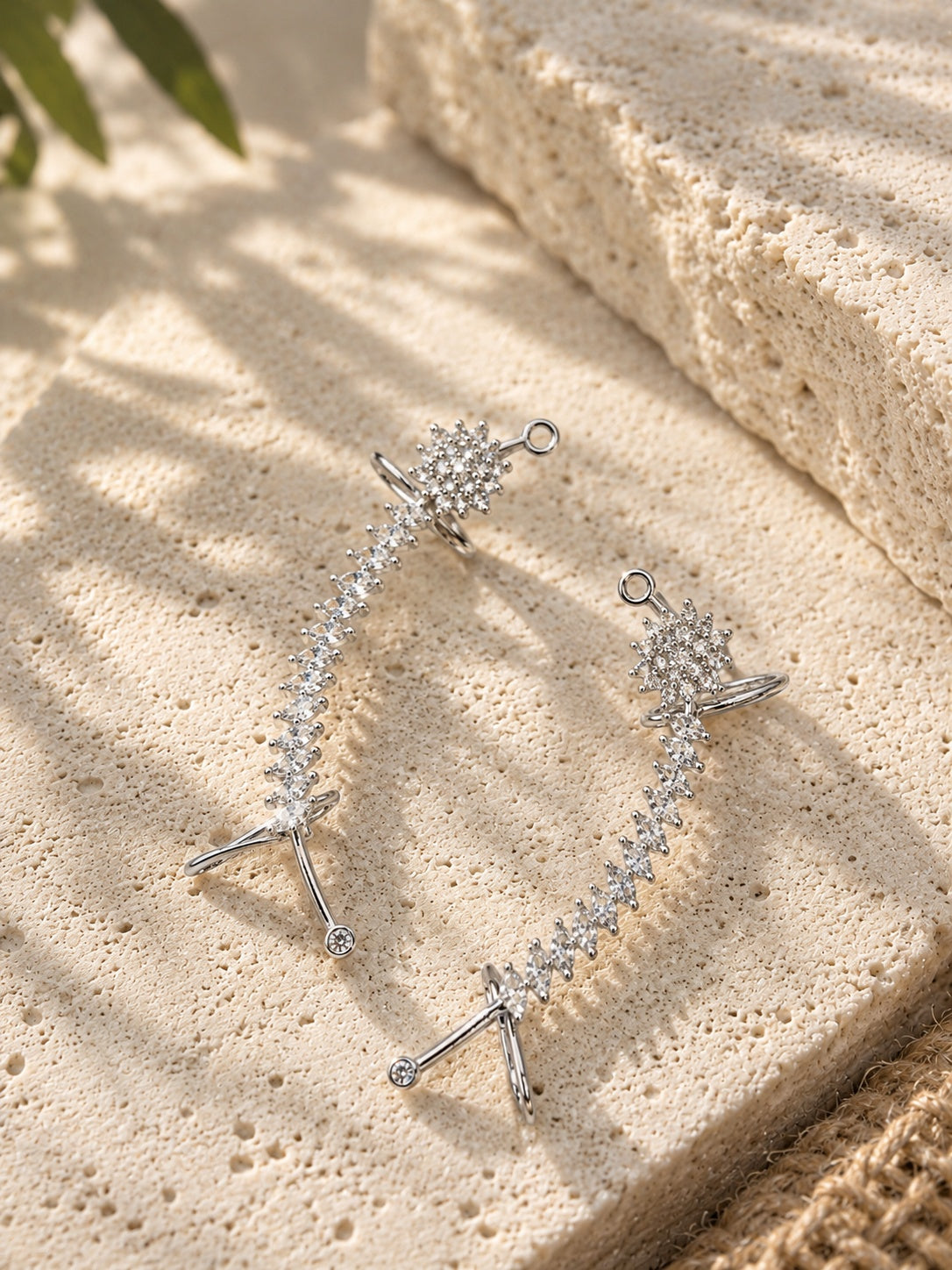NISKA AD stone silver replica statement drop earrings on textured travertine