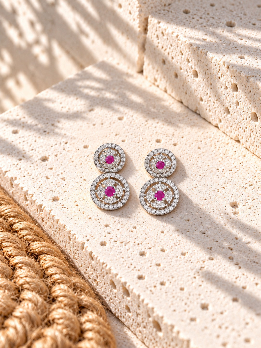 Niska AD Stone Silver replica pink floral drop earrings on white travertine
