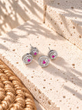 Niska AD Stone Silver replica pink floral drop earrings on white travertine