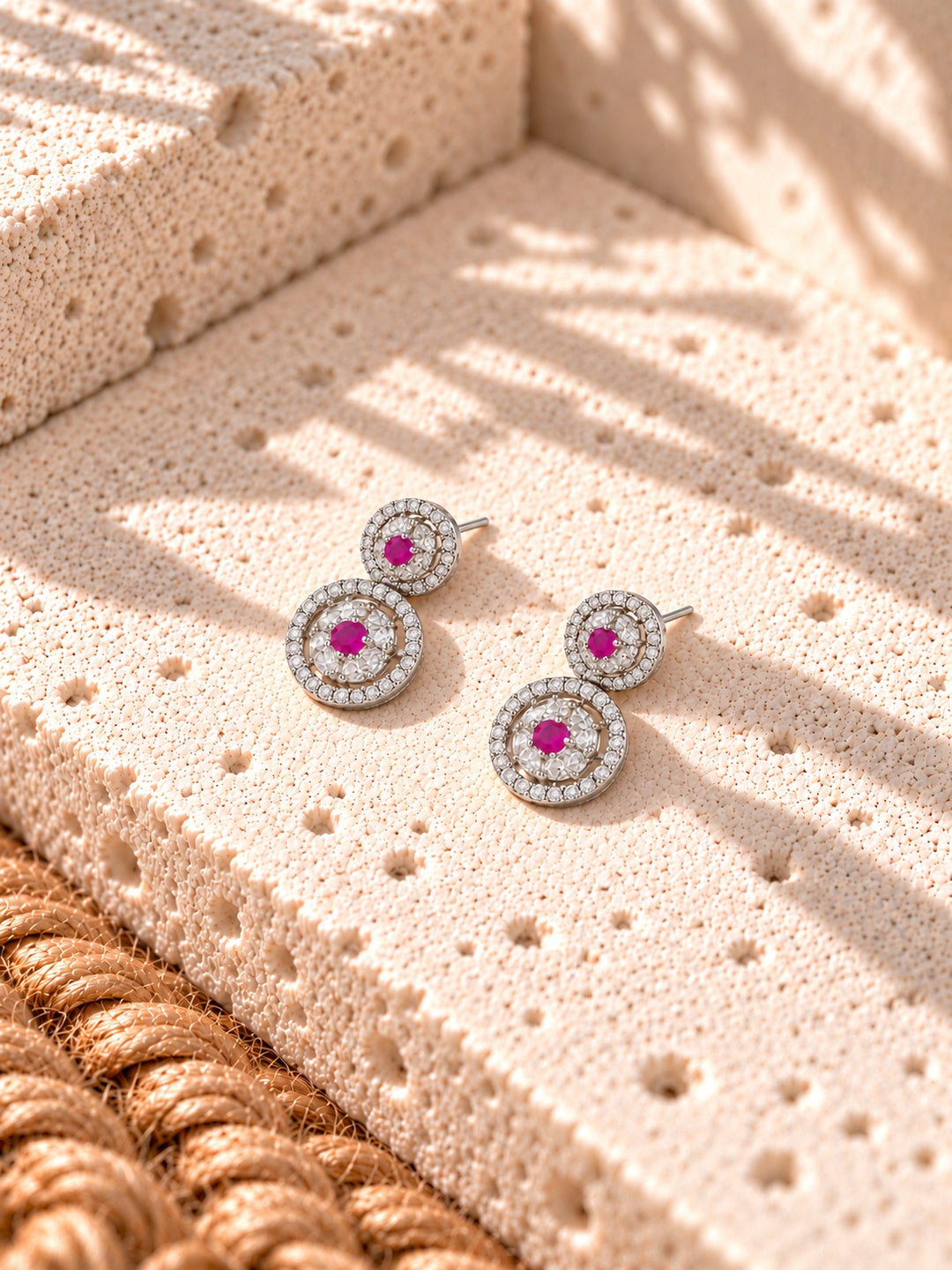 Niska AD Stone Silver replica pink floral drop earrings on white travertine