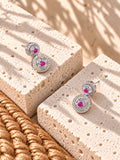 Niska AD Stone Silver replica pink floral drop earrings on white travertine