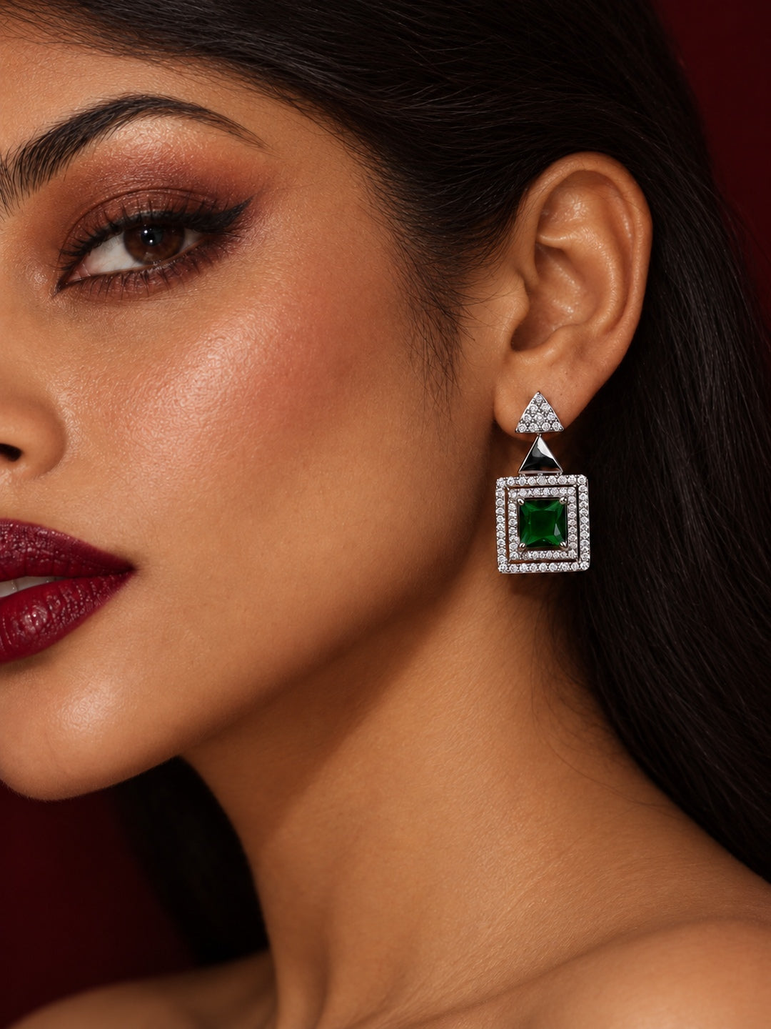 Niska green AD Stone Silver replica earring worn by model with swept-back hair