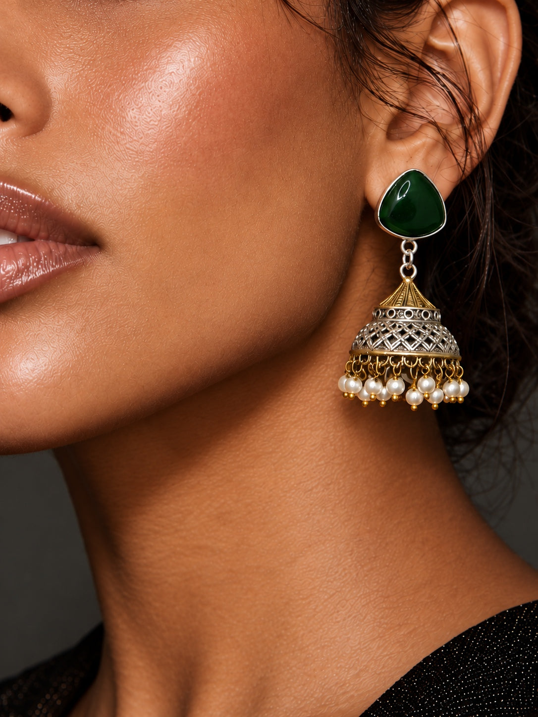 Niska green AD Stone Silver Replica jhumka earring worn by model, close-up