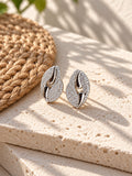 Niska Silver replica AD Stone leaf stud earrings on white travertine view 2