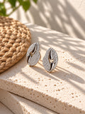 Niska Silver replica AD Stone leaf stud earrings on white travertine view 3
